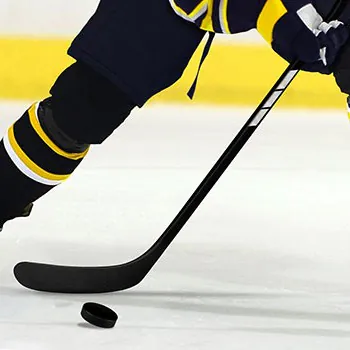 hockey stick and puck close-up